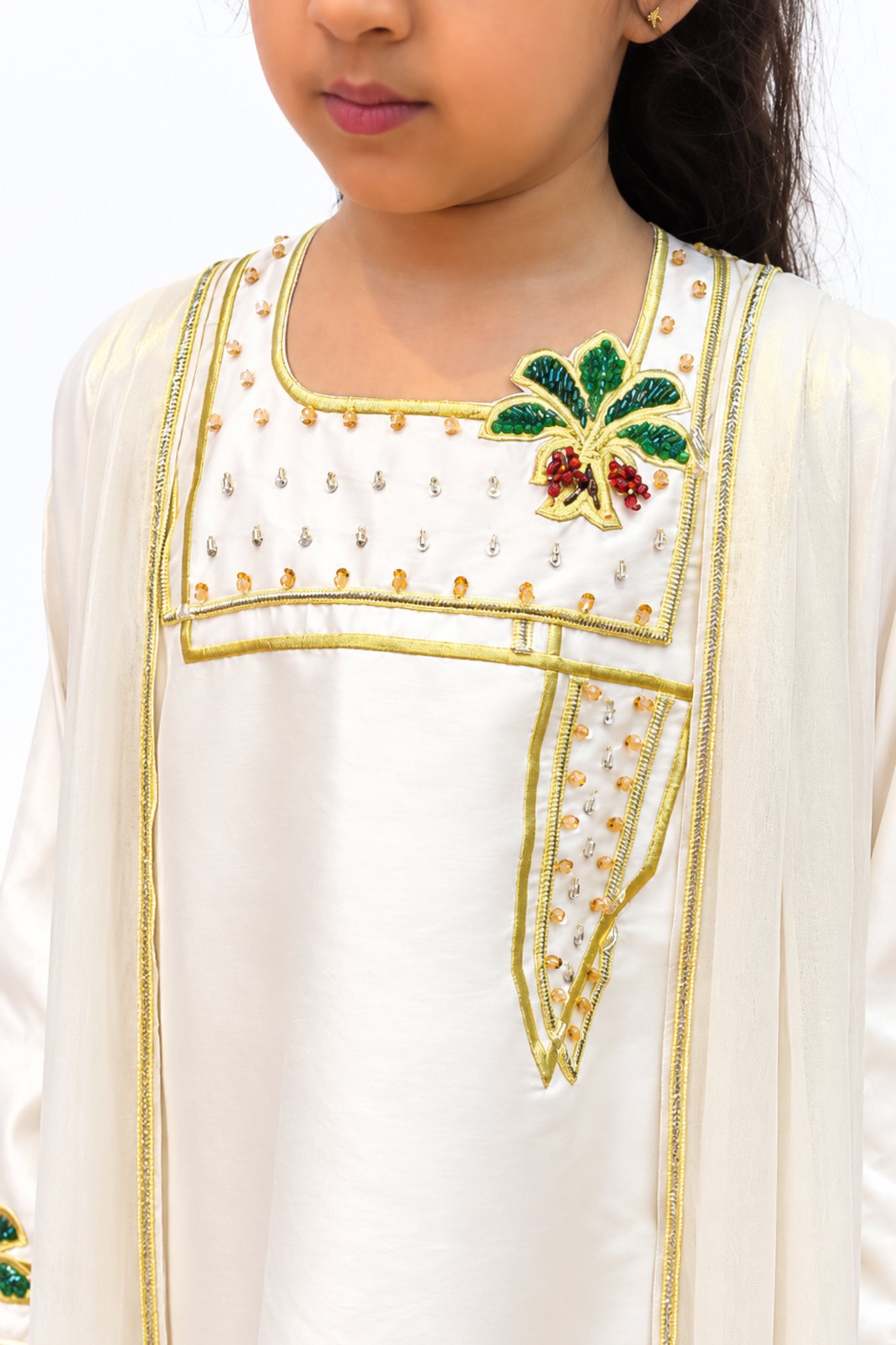 Golden Pearl kids jalabiya by OSH, pearl ivory with gold trim and green and gold floral embroidery