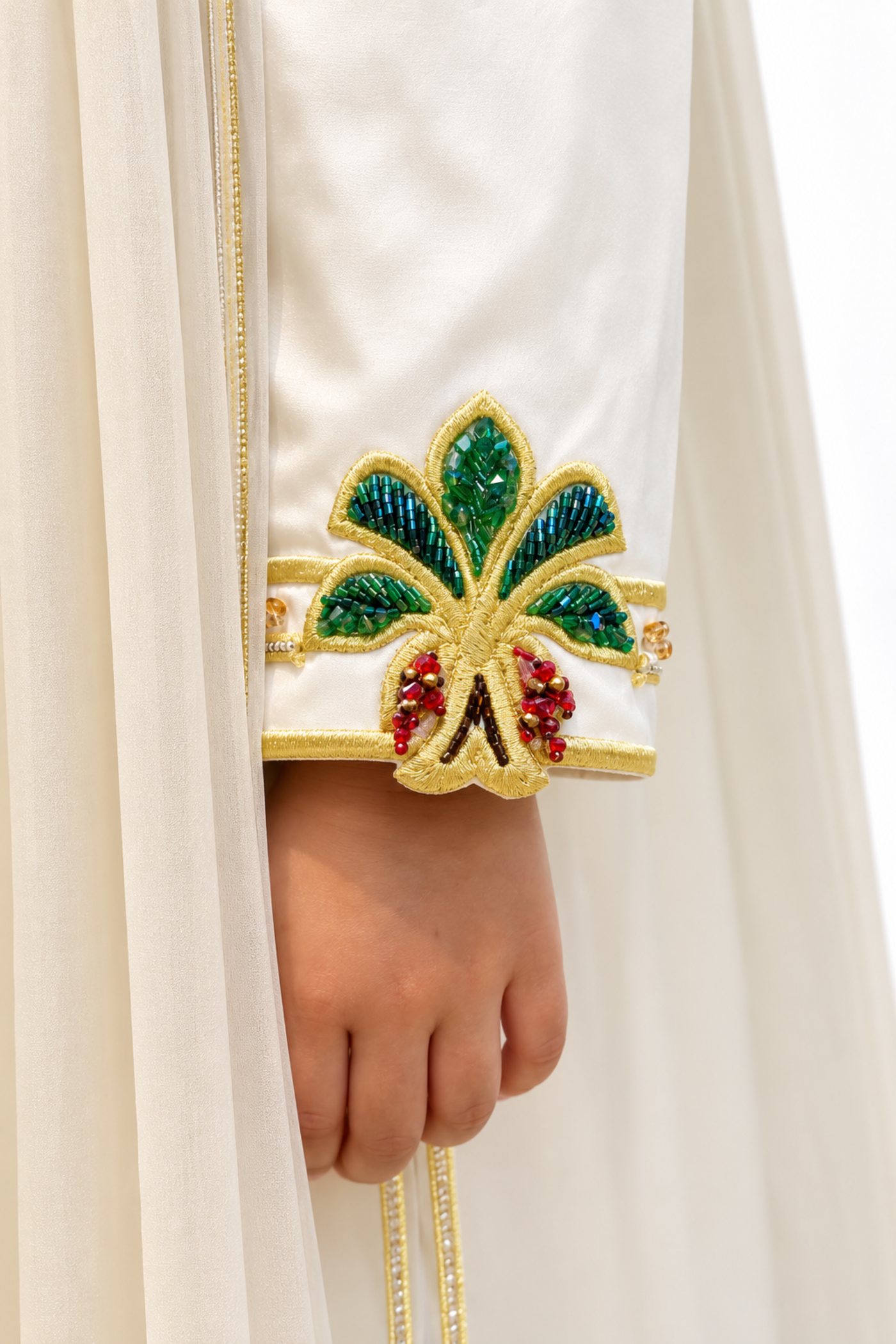 Golden Pearl kids jalabiya by OSH, pearl ivory with gold trim and green and gold floral embroidery